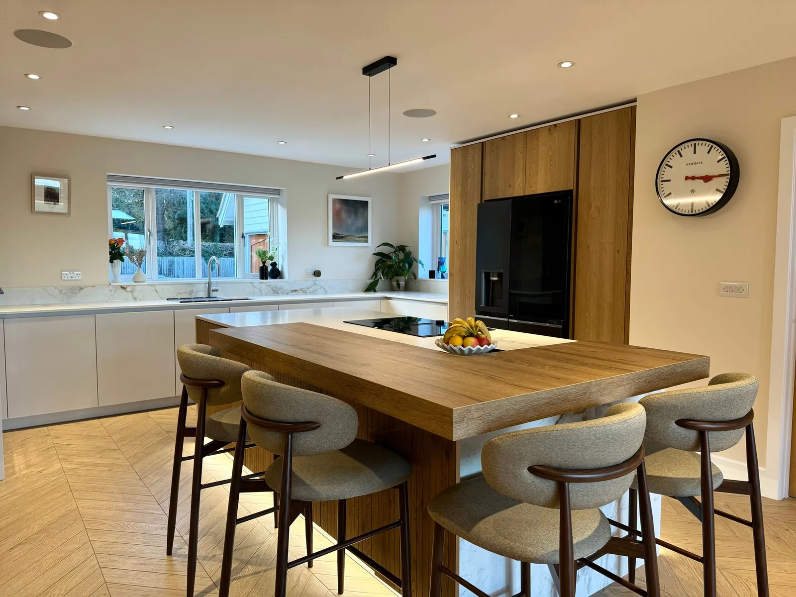A Luxury Bespoke Kitchen Featuring a Statement Island and Fluted Oak Detailing