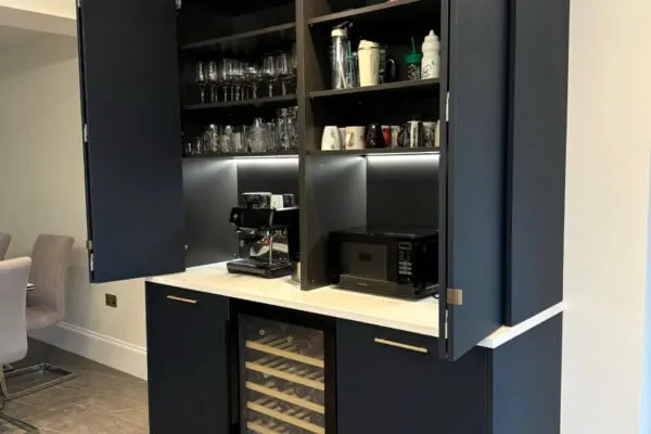 Bespoke kitchen bar and coffee station with concealed storage, wine cooler and quartz worktops